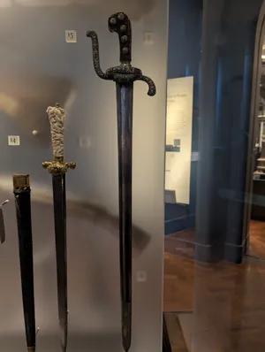 The crossbar and basic handguard of a sabre.