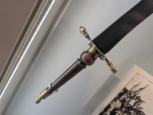 The crossbar of a dagger.